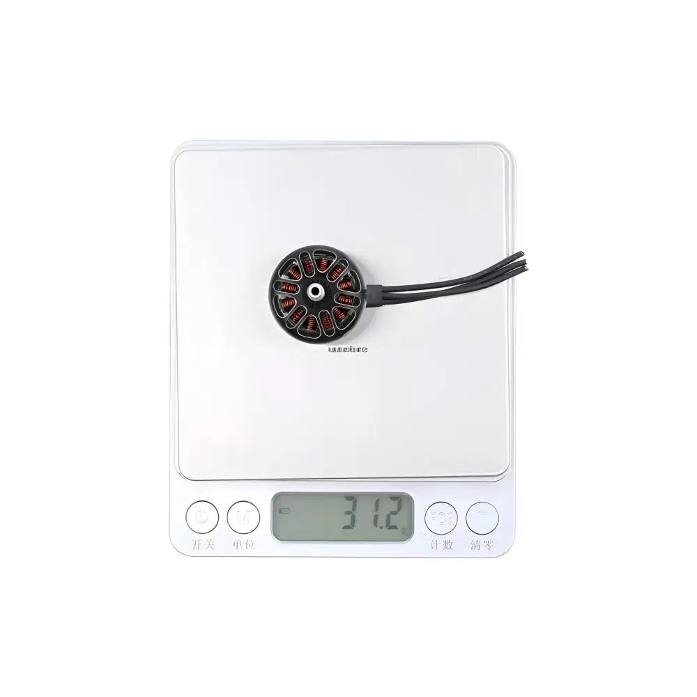 Digital kitchen scale displaying 31.2 grams with a small circular object on its surface.