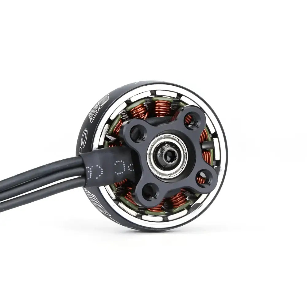 Electric motor with visible copper windings and a central bearing.